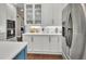Kitchen featuring white cabinets, stainless steel appliances, and modern countertops at 1420 Shady Meadow Ln, Deland, FL 32724