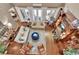 Birds eye view of open-concept living room with hardwood floors and stylish furniture at 1420 Shady Meadow Ln, Deland, FL 32724