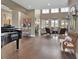 Bright and airy living room featuring hardwood floors and high ceilings filled with natural light at 1420 Shady Meadow Ln, Deland, FL 32724