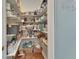 Organized walk-in pantry with abundant shelving and storage for food items at 1420 Shady Meadow Ln, Deland, FL 32724