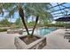 Relaxing screened pool and hot tub area with mature landscaping at 1420 Shady Meadow Ln, Deland, FL 32724