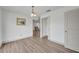 Dining room with wood floors, neutral walls, and classic chandelier at 150 Reef Rd, South Daytona, FL 32119