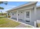 Close-up of a home's entrance featuring a covered porch and well-maintained facade at 150 Reef Rd, South Daytona, FL 32119