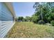 A spacious yard with green grass is ready for entertainment and outdoor enjoyment at 1598 Montgomery Ave, Daytona Beach, FL 32117