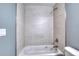 Bathroom featuring a white tub with decorative tile surround at 1598 Montgomery Ave, Daytona Beach, FL 32117