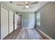Bedroom showcasing ceiling fan, closet, and natural light at 1598 Montgomery Ave, Daytona Beach, FL 32117