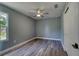 Bedroom featuring wood-look floors, a modern ceiling fan and natural light at 1598 Montgomery Ave, Daytona Beach, FL 32117