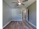 Bedroom with a modern ceiling fan and wood-look flooring at 1598 Montgomery Ave, Daytona Beach, FL 32117