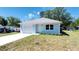 A charming exterior view highlighting new construction, single car garage, and manicured lawn at 1598 Montgomery Ave, Daytona Beach, FL 32117