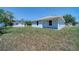 Exterior view of a beautiful single-story home with a well-manicured front lawn at 1598 Montgomery Ave, Daytona Beach, FL 32117