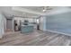 An open kitchen and living area featuring stainless steel appliances and an island at 1598 Montgomery Ave, Daytona Beach, FL 32117