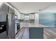 Bright kitchen with white cabinets, stainless steel appliances, and a granite-topped center island at 1598 Montgomery Ave, Daytona Beach, FL 32117