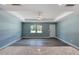 Light and airy room boasting modern flooring, fan, recessed lights, & a granite countertop at 1598 Montgomery Ave, Daytona Beach, FL 32117