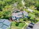 Aerial view of blue condo community surrounded by lush landscaping and mature trees at 161 Blue Heron Dr # C, Daytona Beach, FL 32119