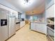 Spacious kitchen with stainless steel appliances, ample cabinets, and adjoining dining area at 161 Blue Heron Dr # C, Daytona Beach, FL 32119