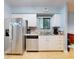 This kitchen has stainless appliances, granite countertops, and white cabinets at 161 Blue Heron Dr # C, Daytona Beach, FL 32119