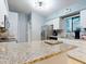 Updated kitchen features stainless steel appliances, stone countertops, and white cabinets at 161 Blue Heron Dr # C, Daytona Beach, FL 32119