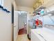 Laundry area features shelving, tile flooring and a hot water tank at 161 Blue Heron Dr # C, Daytona Beach, FL 32119