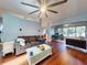 Inviting living room featuring hardwood floors, a comfortable sofa, and a view into the dining room at 161 Blue Heron Dr # C, Daytona Beach, FL 32119