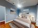 Serene main bedroom with a comfortable bed, soft lighting, and tasteful wall art at 161 Blue Heron Dr # C, Daytona Beach, FL 32119