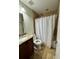 Bathroom featuring tile flooring, granite countertops and a tub with shower at 1649 Courtland Blvd, Deltona, FL 32738