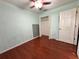 Cozy bedroom with hardwood floors, closet, and a ceiling fan at 1649 Courtland Blvd, Deltona, FL 32738