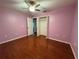 This spacious bedroom features hardwood floors, closet, and plenty of natural light at 1649 Courtland Blvd, Deltona, FL 32738