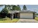 Charming single-story brick home featuring a two-car garage and solar panels at 1649 Courtland Blvd, Deltona, FL 32738