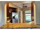 Kitchen features granite counters, breakfast bar, stainless refrigerator and pantry at 1649 Courtland Blvd, Deltona, FL 32738