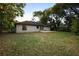 A wide backyard that is full of space and has a patio to enjoy outdoor activities at 1731 Urbana Ave, Deltona, FL 32725