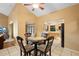Dining area with kitchen view and access to outdoor lanai at 1731 Urbana Ave, Deltona, FL 32725
