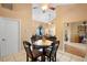 Dining area showing open living and kitchen spaces, with ceiling fan and ample natural light at 1731 Urbana Ave, Deltona, FL 32725