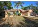 Charming single-story brick home with a well-maintained lawn and mature landscaping, creating great curb appeal at 1731 Urbana Ave, Deltona, FL 32725