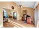 Stylish living room with hardwood floors, high ceilings, fan, desk, and ample natural light, ideal for work and relaxation at 1731 Urbana Ave, Deltona, FL 32725