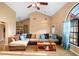 Open concept living room with vaulted ceilings, hardwood floors, and seamless flow to dining area at 1731 Urbana Ave, Deltona, FL 32725