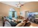 Inviting living room with vaulted ceilings, hardwood floors, and a large window, creating a cozy and stylish environment at 1731 Urbana Ave, Deltona, FL 32725