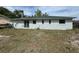 Spacious backyard featuring a grassy lawn and exterior view of the home at 1808 Green Pl, Ormond Beach, FL 32174