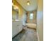 Updated bathroom with a stylish vanity, marble-look shower, and elegant slate flooring, providing a spa-like experience at 1808 Green Pl, Ormond Beach, FL 32174