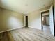 Bright bedroom featuring laminate floors, neutral walls, and ample closet space for a comfortable and organized living area at 1808 Green Pl, Ormond Beach, FL 32174