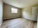 Bedroom with light wood flooring, natural light, and neutral paint at 1808 Green Pl, Ormond Beach, FL 32174