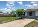 A well-maintained home exterior, complemented by mature landscaping and a spacious driveway at 1808 Green Pl, Ormond Beach, FL 32174