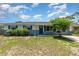 Charming single-story home with blue shutters and a well-maintained front yard, perfect for curb appeal at 1808 Green Pl, Ormond Beach, FL 32174