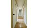 Hallway features neutral walls, tile flooring, and white doors at 1808 Green Pl, Ormond Beach, FL 32174