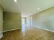 Spacious living room with tiled floors, neutral walls, and ample natural light perfect for relaxing or entertaining guests at 1808 Green Pl, Ormond Beach, FL 32174