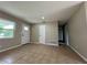Inviting living room featuring tiled floors, neutral paint, and great natural light from the window for comfortable living at 1808 Green Pl, Ormond Beach, FL 32174