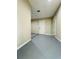 Spacious utility room with concrete flooring and white door at 1808 Green Pl, Ormond Beach, FL 32174