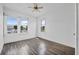 Bedroom featuring hard wood floors and ample light from multiple windows at 216 Earl St, Daytona Beach, FL 32118