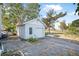 Detached one-car garage with a concrete driveway at 216 Earl St, Daytona Beach, FL 32118