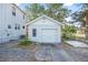 Detached one-car garage with a concrete driveway at 216 Earl St, Daytona Beach, FL 32118