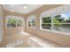 Bright living room with lots of natural light, light-colored walls, and tile floors at 216 Earl St, Daytona Beach, FL 32118